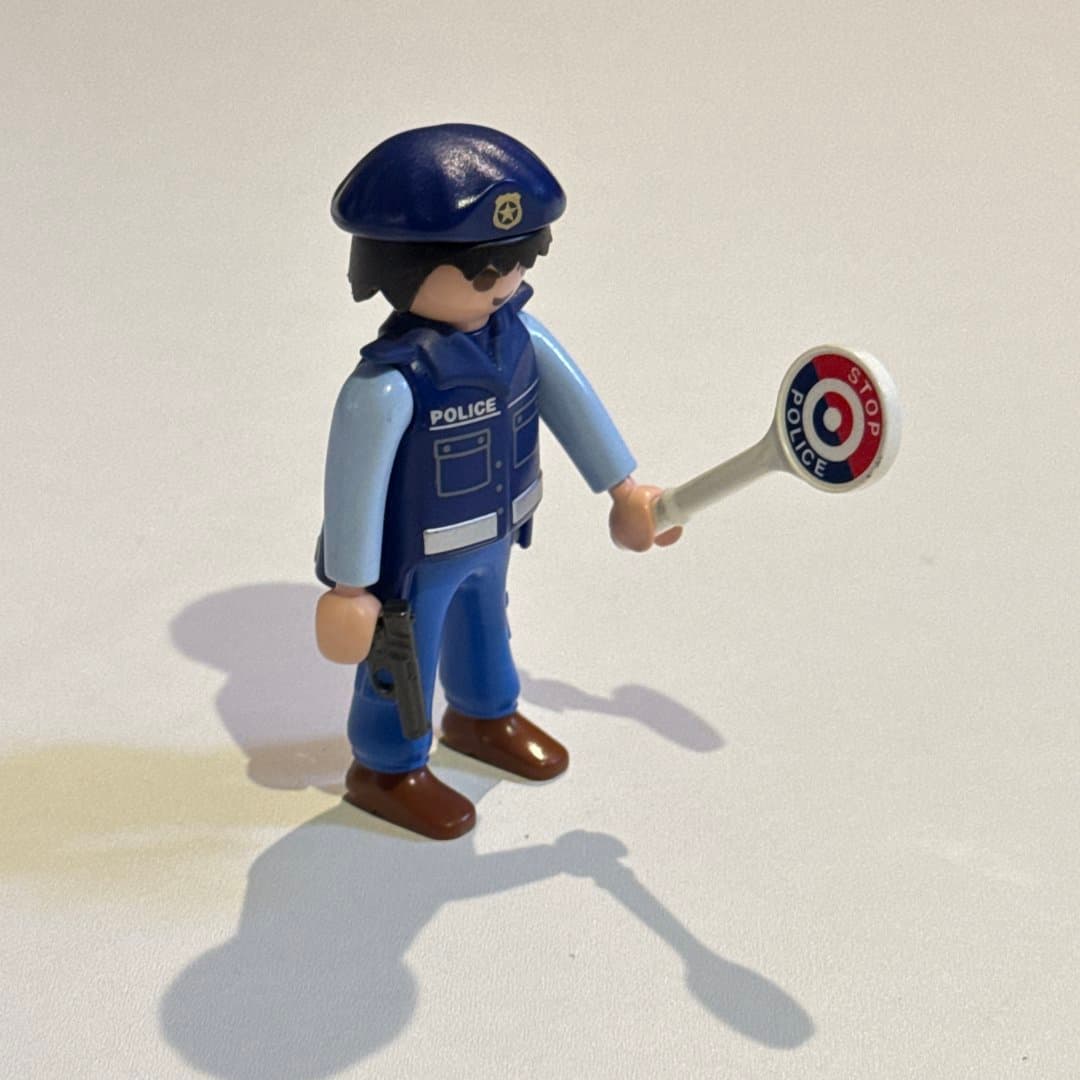 Playmobil Geobra police officer figure with stop sign, pistol, and beret. on Save All