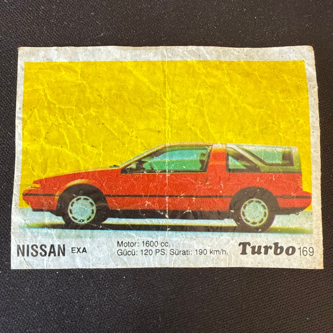 Vintage trading card featuring a red Nissan EXA Turbo car with its specifications. Turbo Gum. on Save All